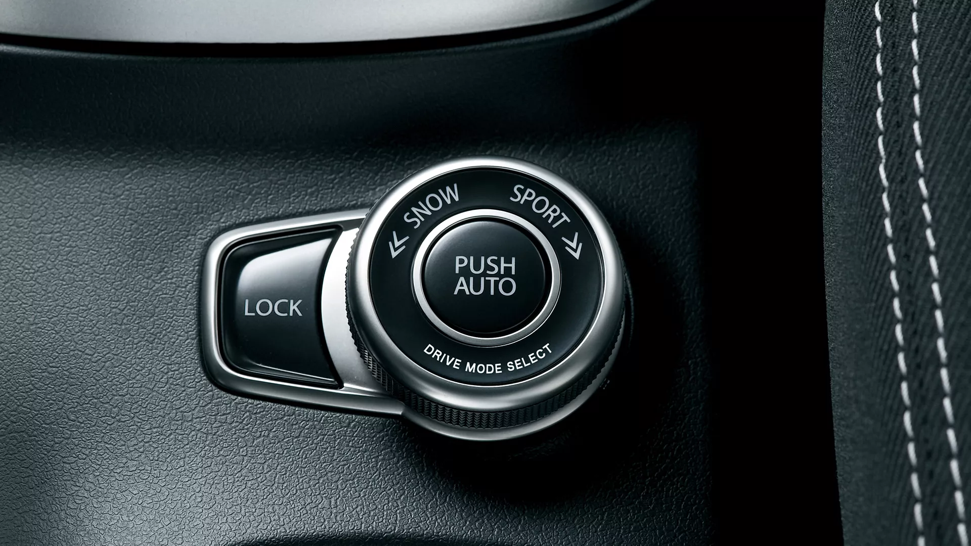 Close-up of the Suzuki ALLGRIP 4WD drive mode selector dial featuring Auto, Sport, Snow, and Lock modes for optimised traction and control.