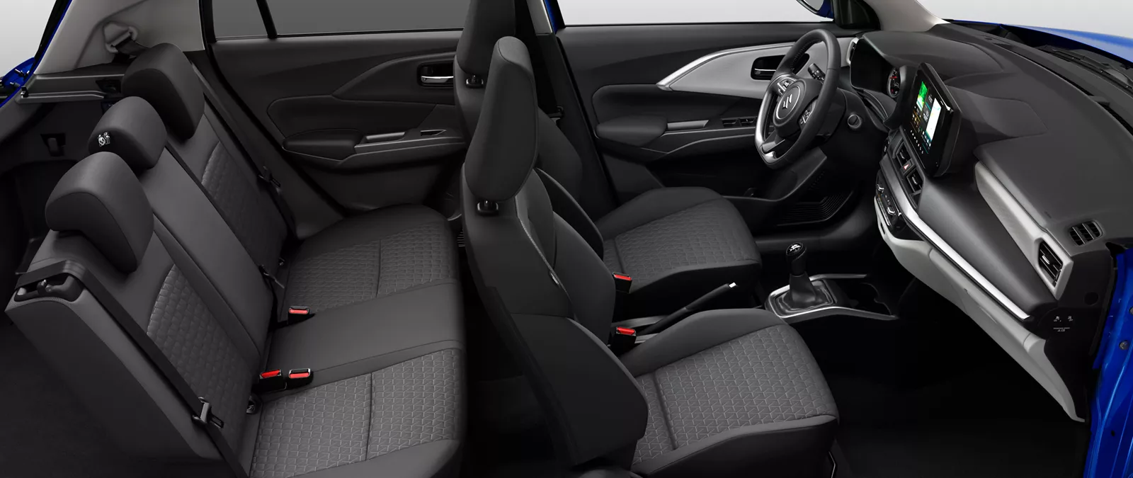 Side view of the Suzuki Swift interior showing front and rear seats, dashboard, and infotainment system