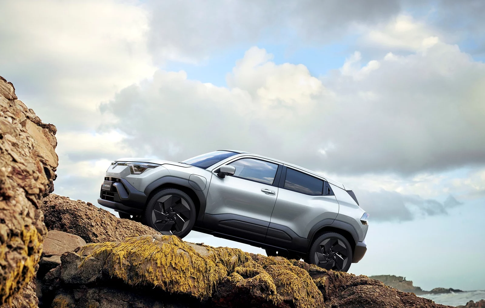 Suzuki e Vitara electric SUV on countryside