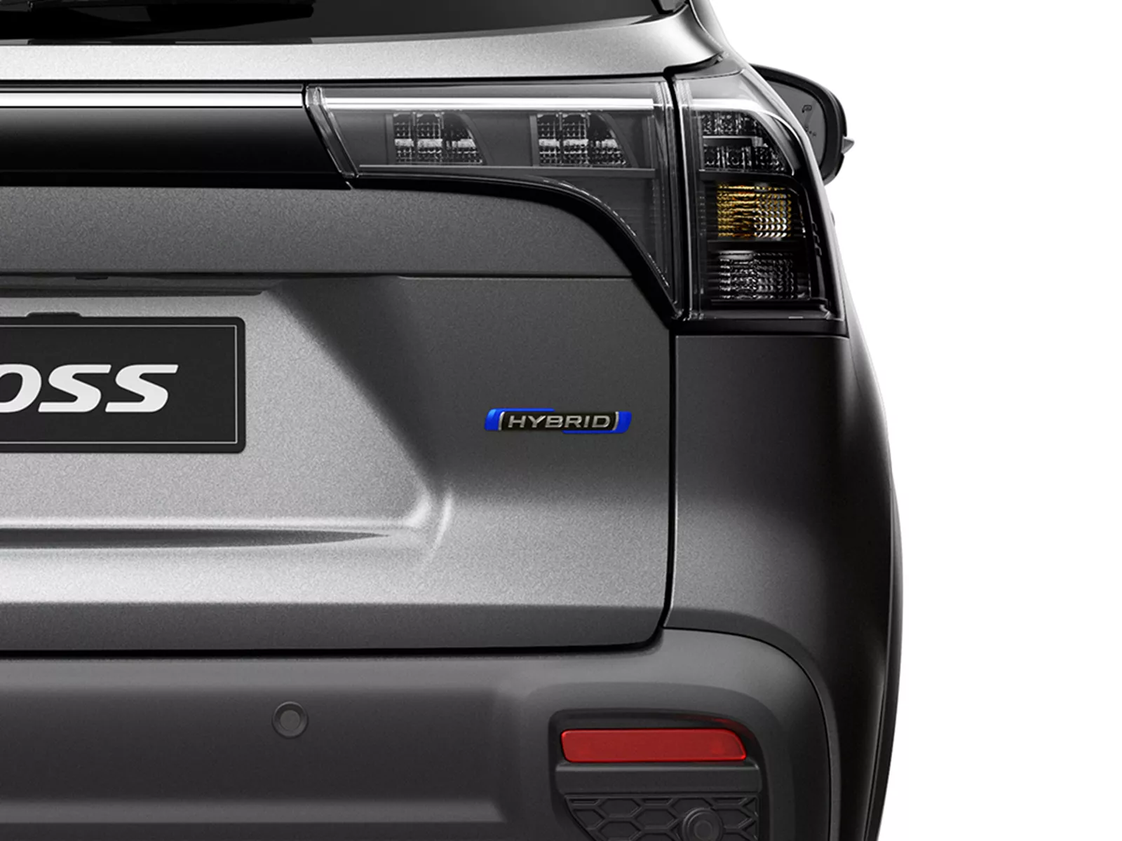 Close-up of the Suzuki s-cross rear tailgate showing the Hybrid badge beneath the tail light, highlighting its electrified drivetrain.