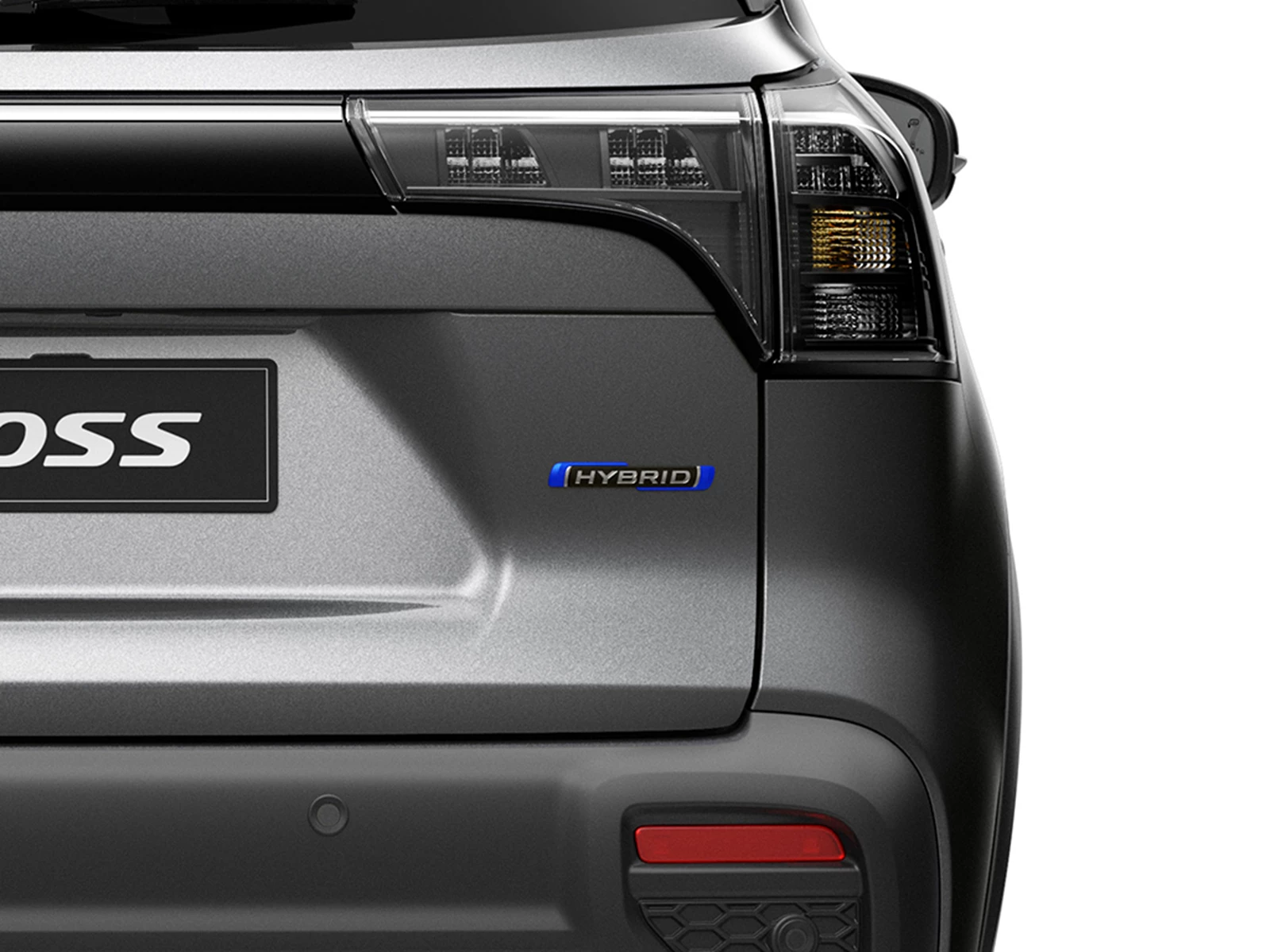 Close-up of the Suzuki s-cross rear tailgate showing the Hybrid badge beneath the tail light, highlighting its electrified drivetrain.