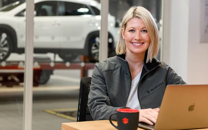 Suzuki Employee at Laptop