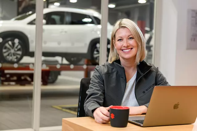 Suzuki Employee at Laptop