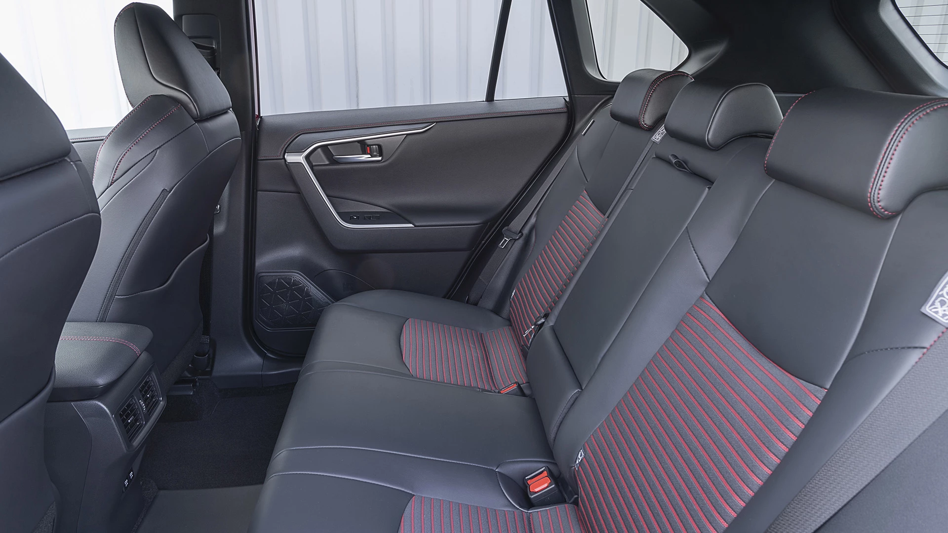 Rear interior view of the Suzuki Across featuring spacious reclining seats.