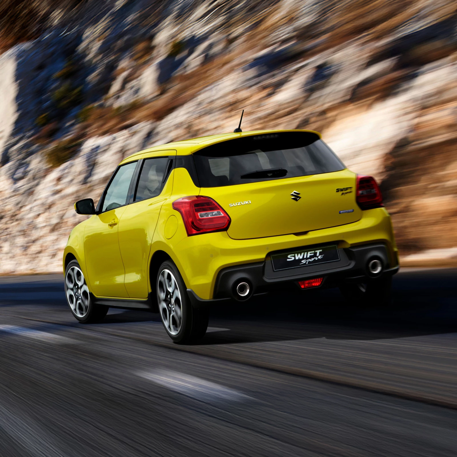 Rear view of a yellow Suzuki Swift Sport