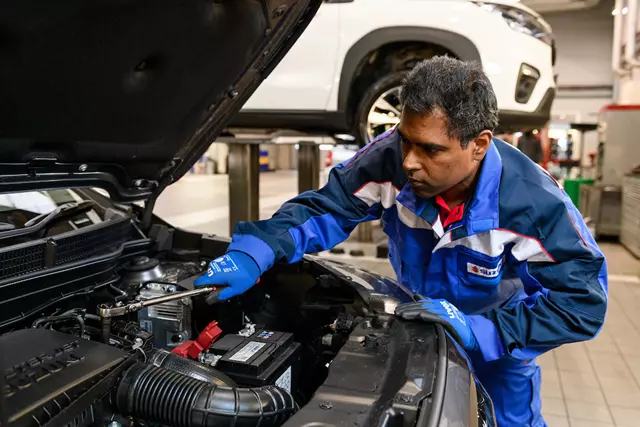 Technician working on engine