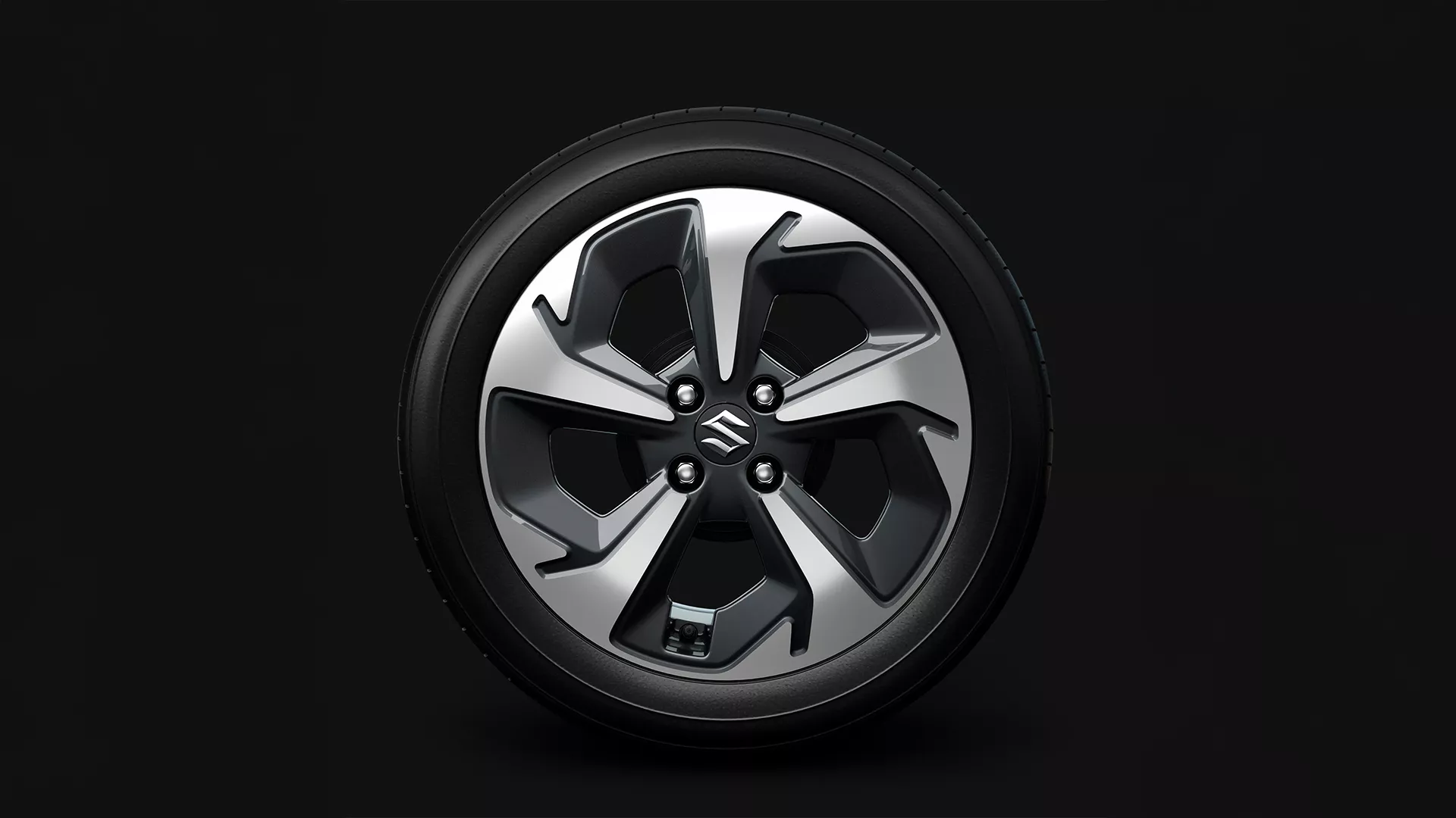 Suzuki Swift 16-inch alloy wheel with dual-tone finish and Suzuki logo at the centre
