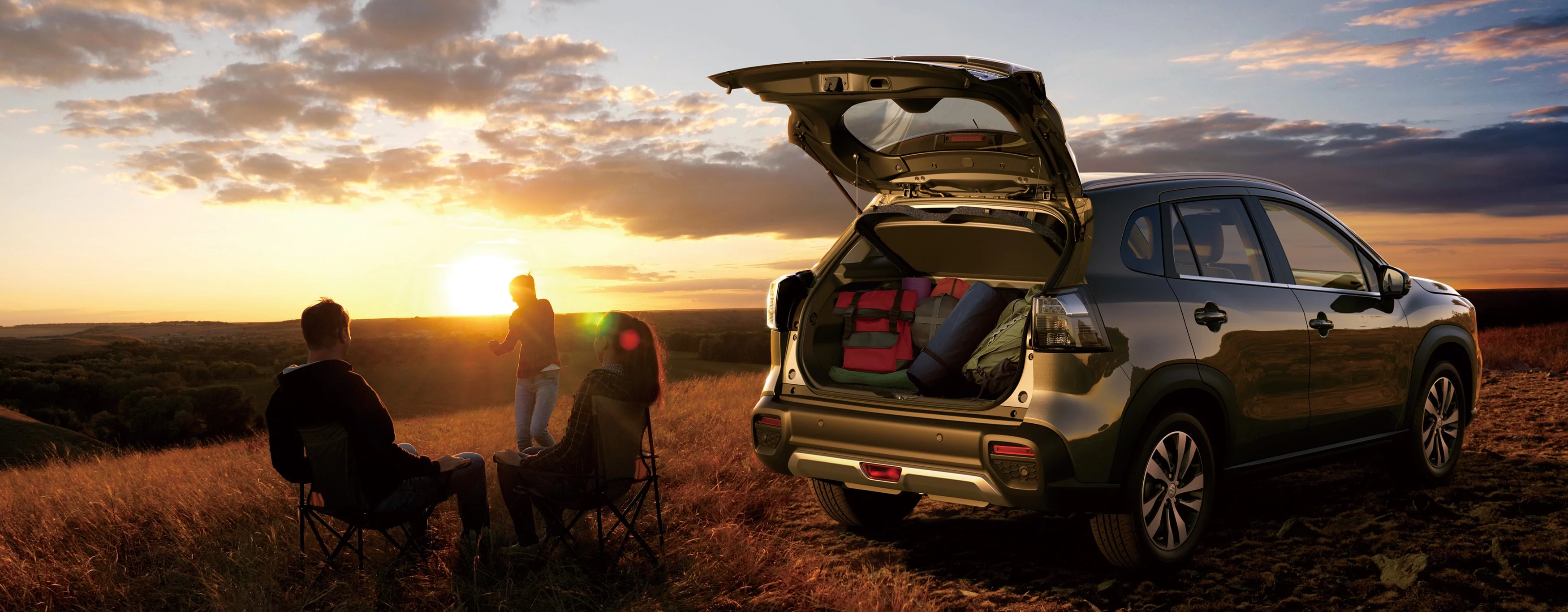 Rear view of a Suzuki Vitara watching the sunset with the boot open