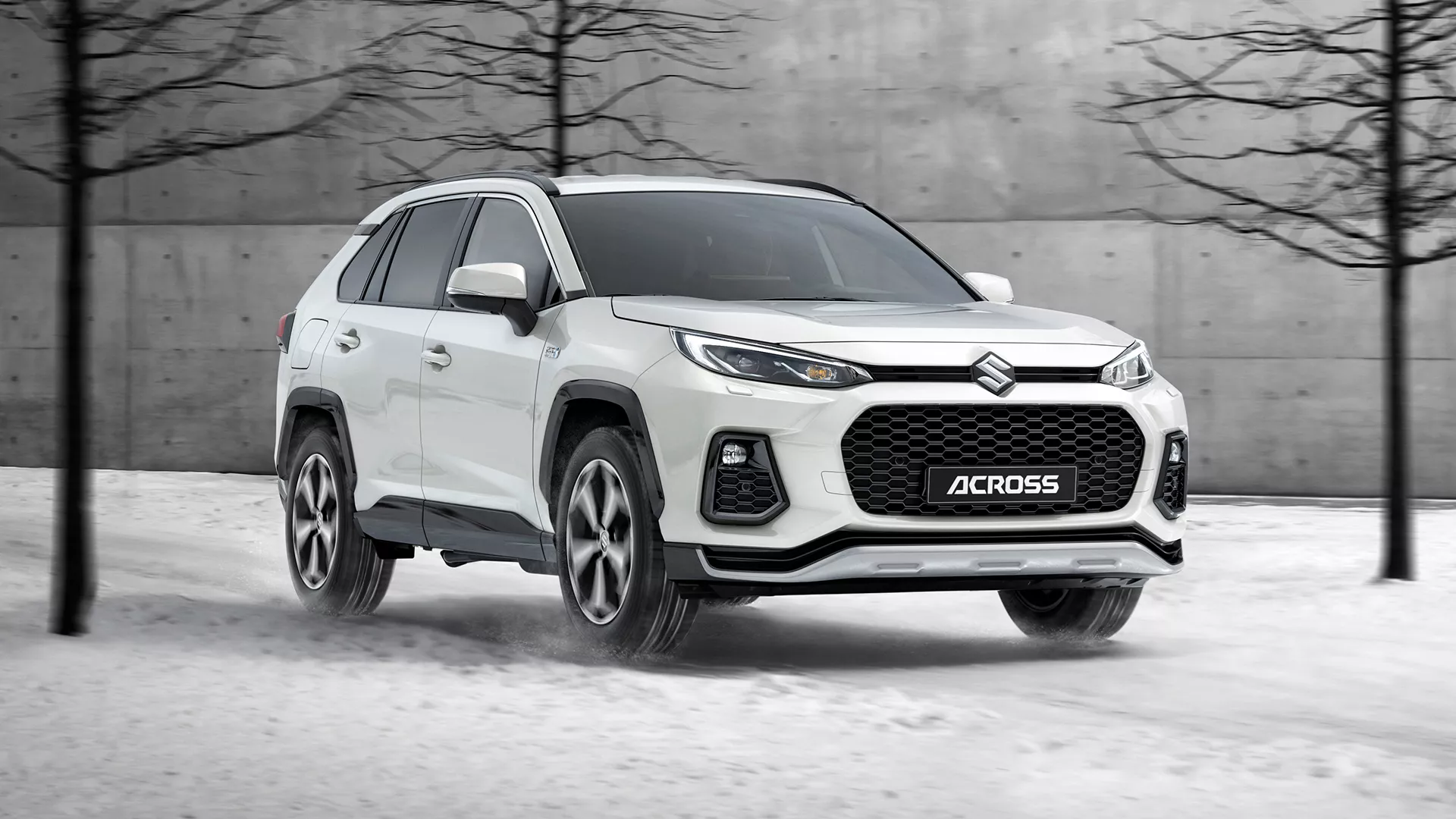 Suzuki Across driving through a snowy landscape, demonstrating the capability of its E-Four 4-wheel drive system for enhanced traction and control in challenging conditions.