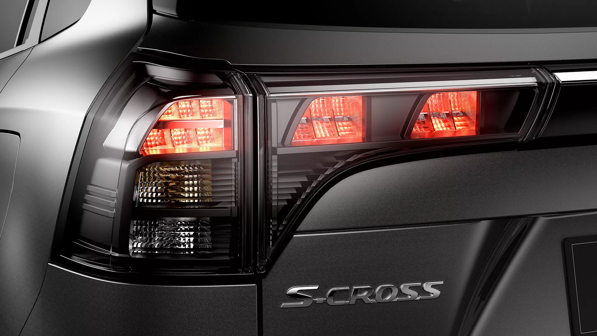 Rear view of Suzuki S-Cross highlighting modern LED tail lights and S-Cross badge.
