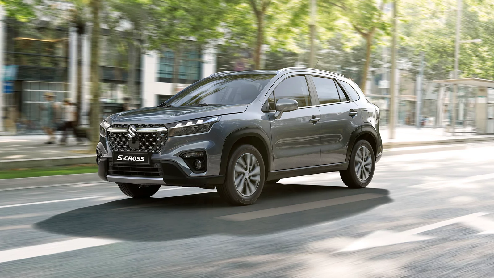 Grey Suzuki S-Cross driving through a city street