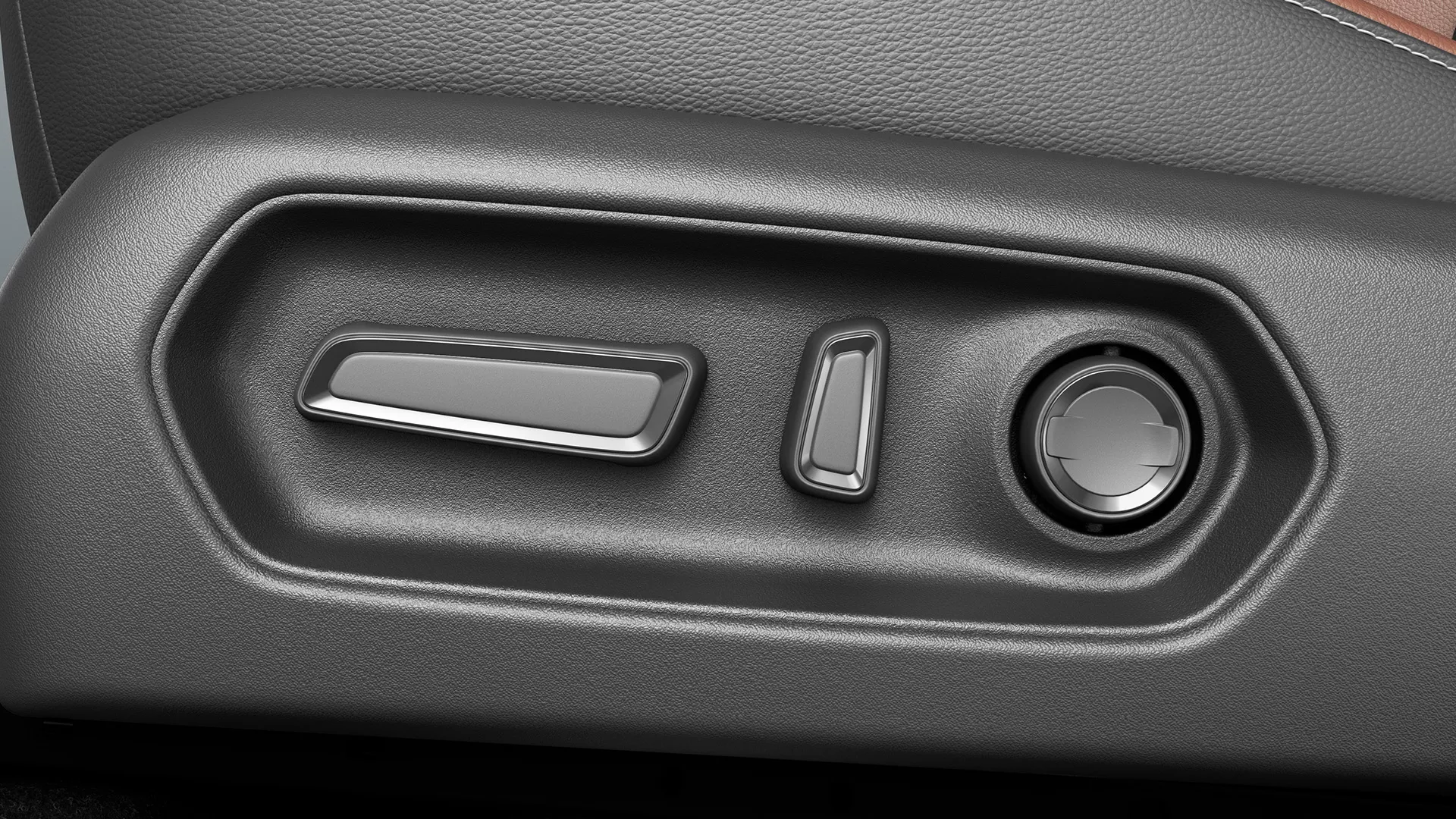 Close-up of the 10-way power-adjustable driver’s seat controls in the Suzuki e Vitara.