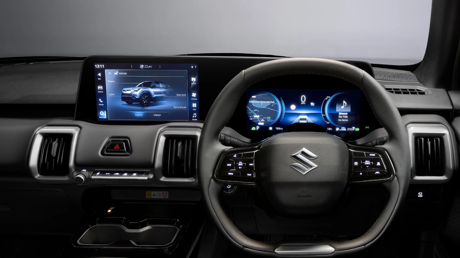 Suzuki e Vitara’s integrated display system, showing the touchscreen infotainment panel and digital driver display