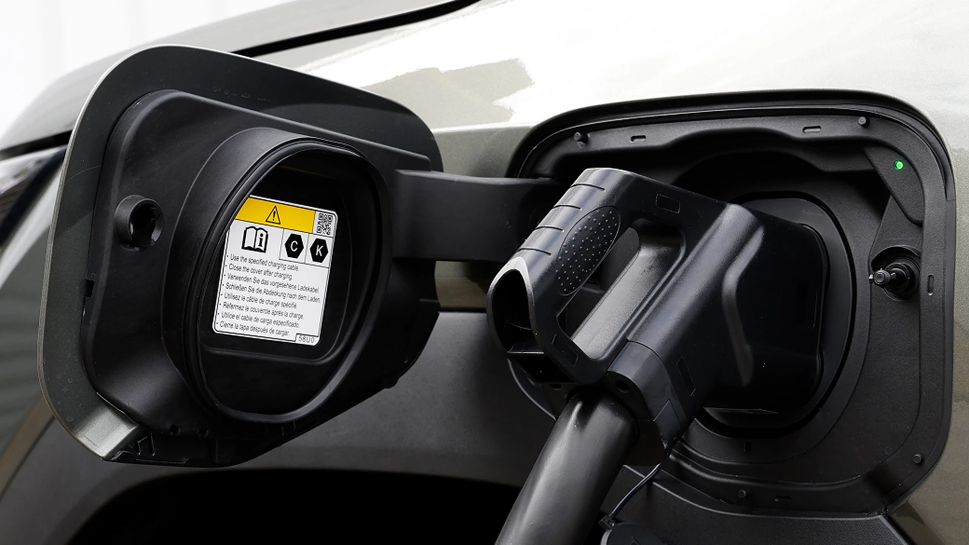 Close-up of a Suzuki e Vitara charging from a home EV charger