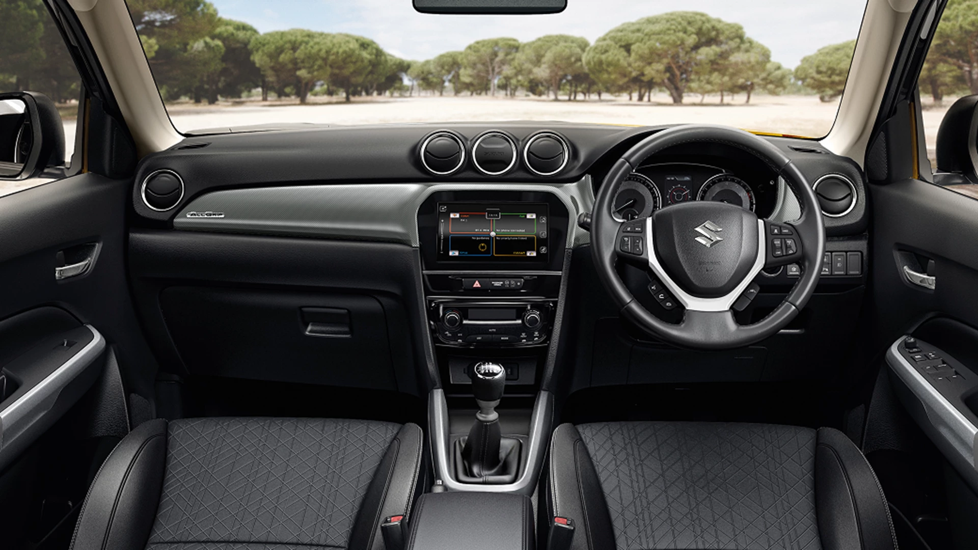 Interior dashboard and front cabin of a Suzuki vehicle with manual transmission